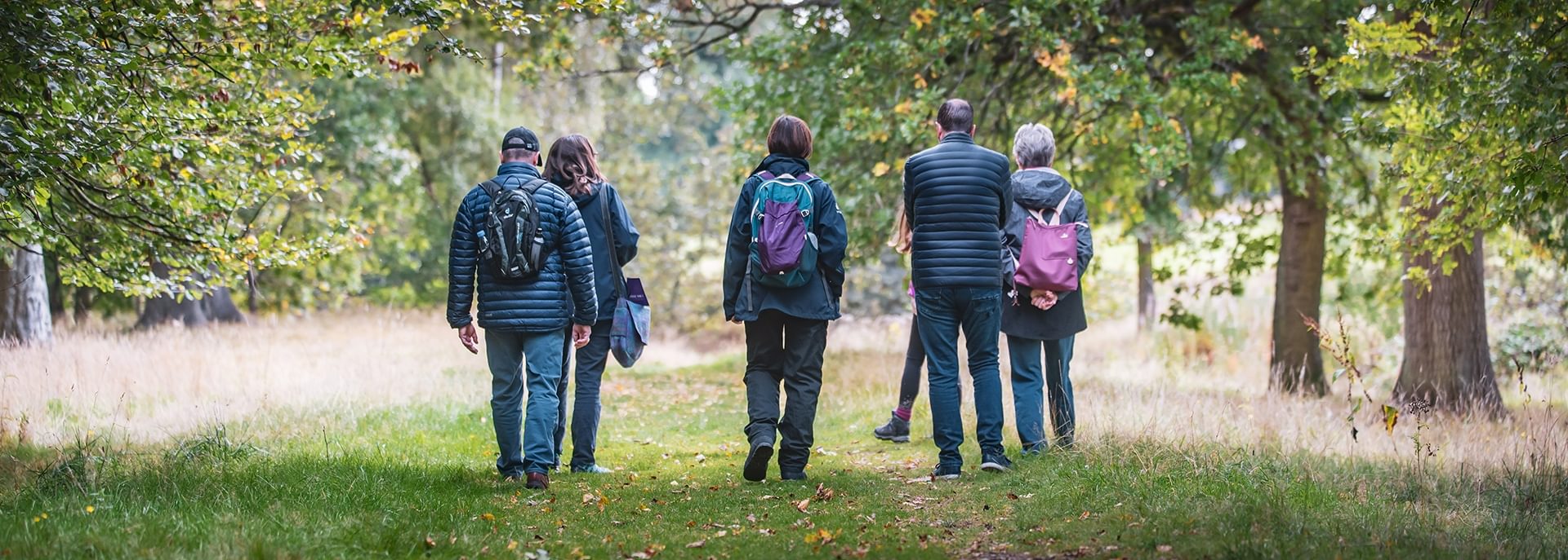 © Rediscovering the Antonine Wall Project
People walking along a leaf strewn grass woodland path. There are broadleaved trees with foliage on either side of the path. © Rediscovering the Antonine Wall Project
People walking along a leaf strewn grass woodland path. There are broadleaved trees with foliage on either side of the path.