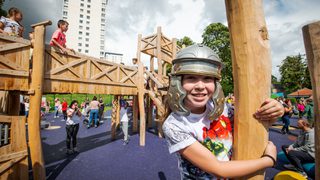 © Historic Environment Scotland
A Roman themed play park with wooden equipment on a sunny day. A smiling child in a white t shirt and a plastic Roman helmet. © Historic Environment Scotland
A Roman themed play park with wooden equipment on a sunny day. A smiling child in a white t shirt and a plastic Roman helmet.