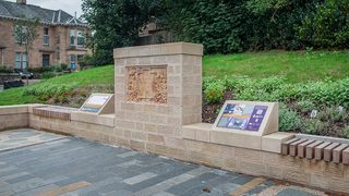 © Rediscovering the Antonine Wall Project
The replica Distance Stone, Falkirk, of sandstone, set in a wall of the same with an interpretation board set in a low wall. © Rediscovering the Antonine Wall Project
The replica Distance Stone, Falkirk, of sandstone, set in a wall of the same with an interpretation board set in a low wall.