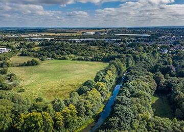 © Rediscovering the Antonine Wall Project
The site of Cadder Roman Fort in a wood covered landscape next to the Forth and Clyde canal with blue skies above. © Rediscovering the Antonine Wall Project
The site of Cadder Roman Fort in a wood covered landscape next to the Forth and Clyde canal with blue skies above.