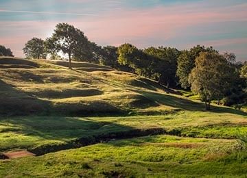 © Rediscovering the Antonine Wall Project
The site of Rough Castle fort on a large grassy hill. Deep shadows highlight mounds and ditches of the forts’ structures. © Rediscovering the Antonine Wall Project
The site of Rough Castle fort on a large grassy hill. Deep shadows highlight mounds and ditches of the forts’ structures.